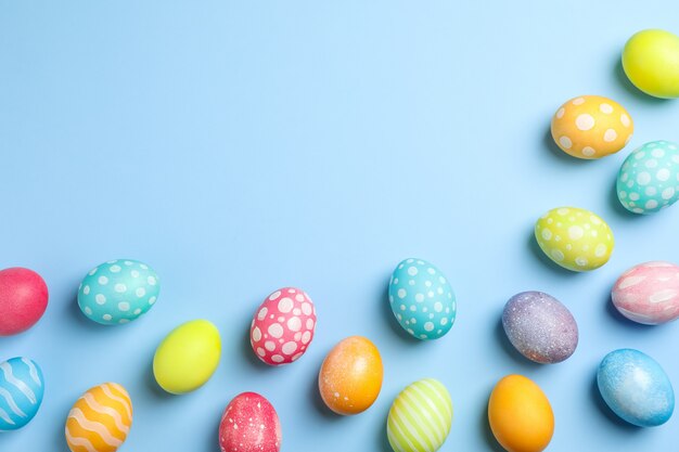 Easter eggs on color background