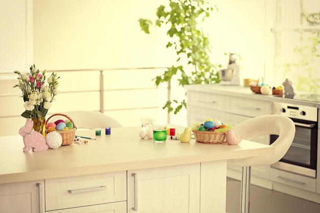 Easter eggs and decorations on table