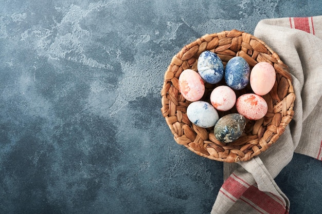 Easter eggs Dyed Easter eggs with marble stone effect ref and blue color in rustic style on dark stone background Easter background Top view