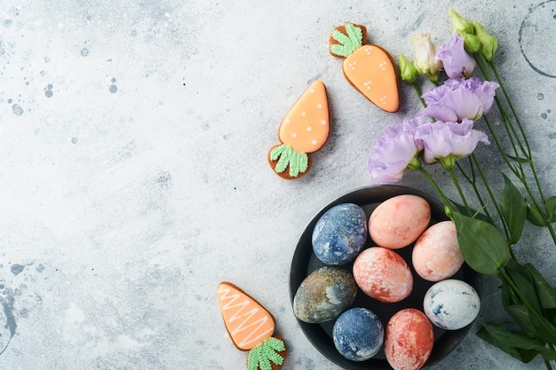 Easter eggs Dyed Easter eggs with marble stone effect ref and blue color in rustic style on light grey stone background Easter background Top view