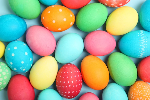 Easter eggs and flowers on the table top view