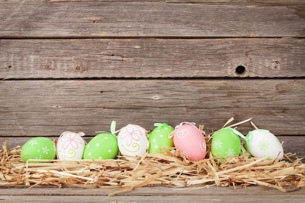 Easter eggs in front of wooden wall