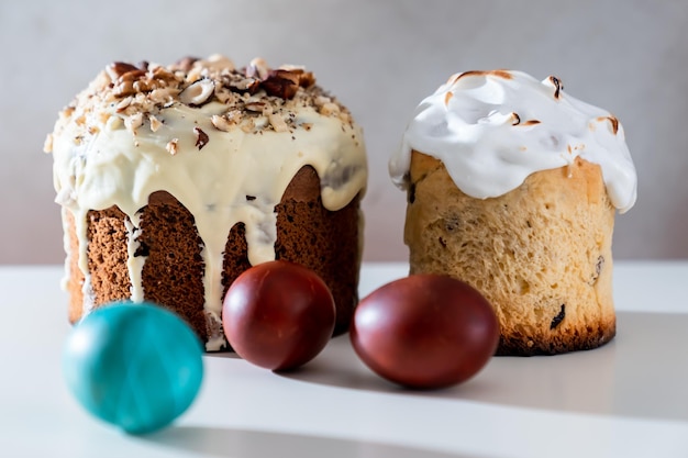 Easter eggs and homemade cakes on a light background