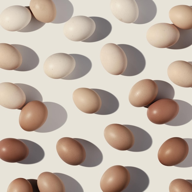 Easter eggs monochrome pattern with gradient colored eggshell hard Shadow at sunlight beige