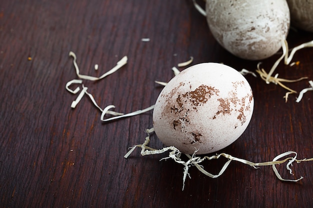 Easter eggs on old brown table