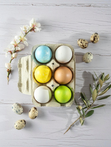 Easter eggs paints to paint by hand and brush on white wood Happy Easter party decorations