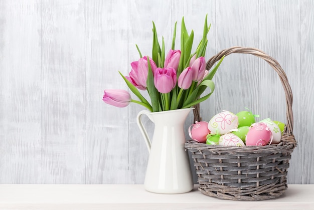 Easter eggs and pink tulips bouquet