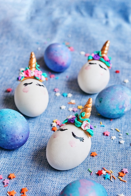 Easter eggs unicorns with painted closed eyes