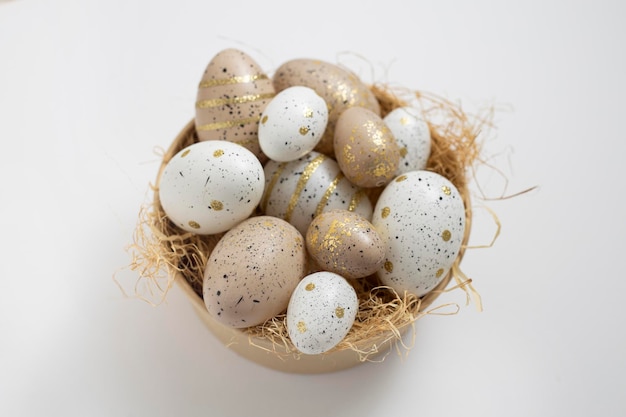 Easter eggs in a vase for decoration on a white background