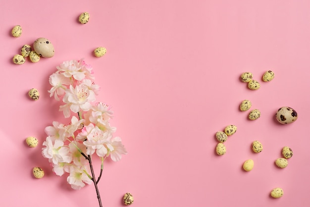 Easter festive composition from quail eggs and cherry tree branch