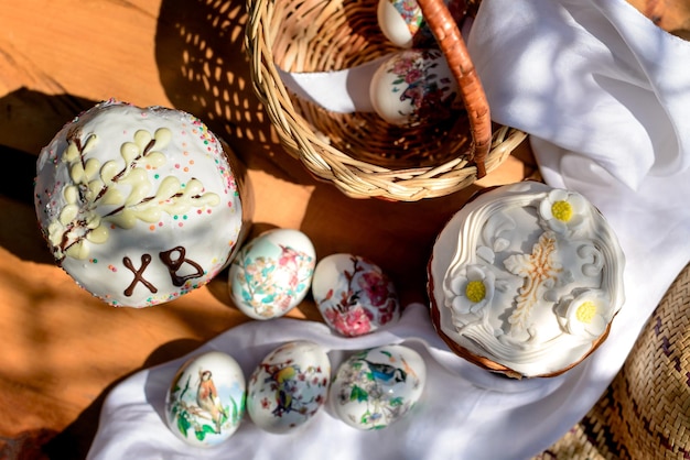 Easter flat lay with cakes and eggs in a basket on Easter day