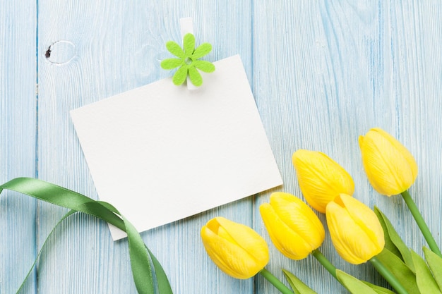 Easter greeting card and yellow tulips