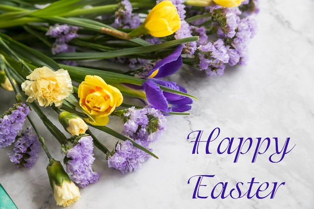 Easter greeting with a bouquet of daffodils and text happy easterfresh yellow daffodil flowers in fu