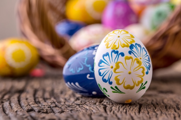 Easter. Hand made easter eggs on old wooden table.