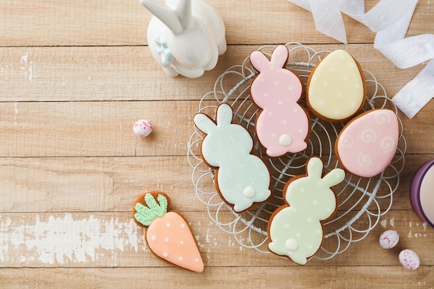 Easter homemade gingerbread rabbits carrots chickens and eggs icing cookies Festive holiday sweet food concept Easter baking or decoration idea White background holiday concept with copy space