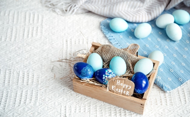 Easter still life with blue eggs, holiday decor