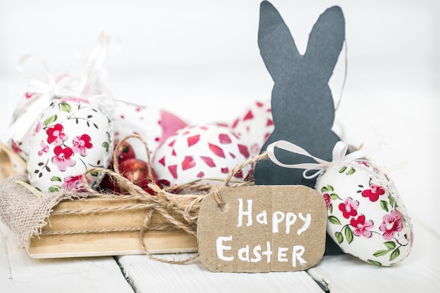 Photo easter still life with eggs and rabbit