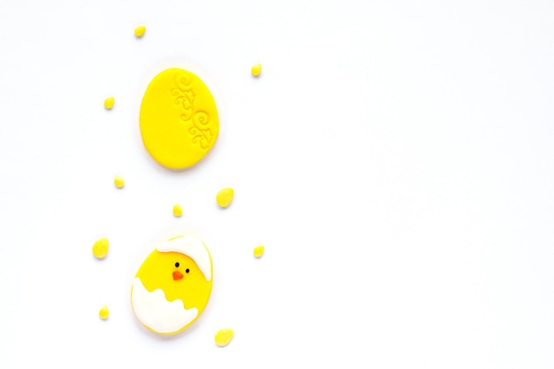 Easter sugar decor in the form of an egg and a chicken on a white background with empty space copyspace