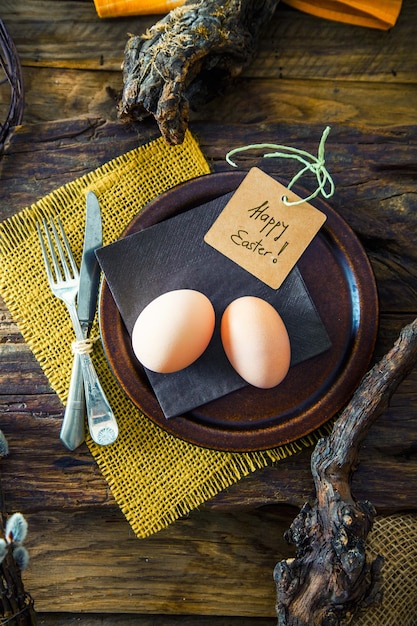 Easter table setting Fresh eggs on plate Spring table