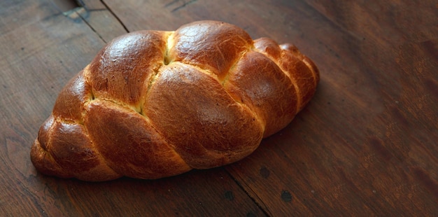 Easter tsoureki braid greek easter sweet bread on wooden background