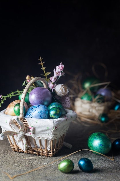 Easter with painted Easter eggs in vintage style over dark