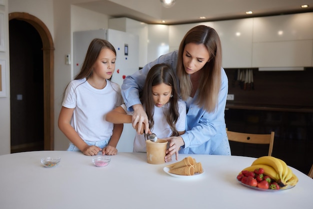 Eating icecream Happy Asian family eating icecream at home Beautiful child feeding mother