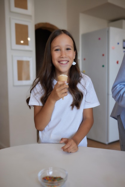 Eating icecream Happy Asian family eating icecream at home Beautiful child feeding mother