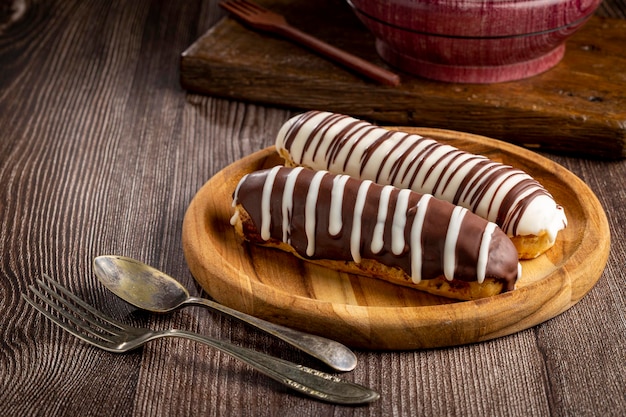 Eclair Tasty chocolate eclair on the table