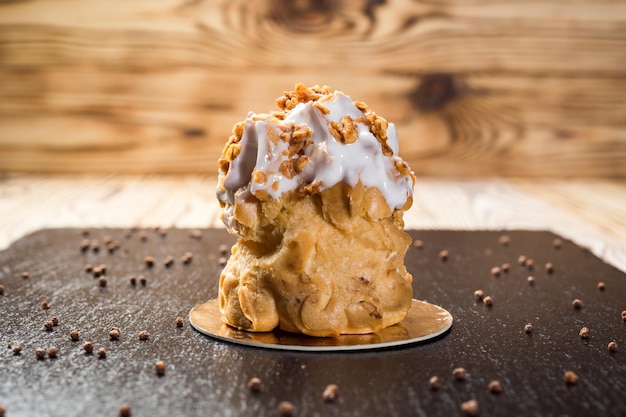 Eclairs with nuts Brewed dough cake