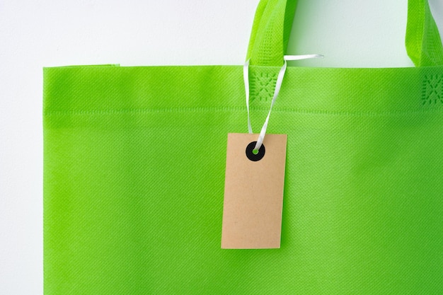 Eco bag for shopping with blank tag on white background