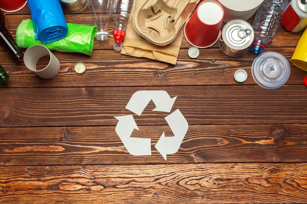 Eco concept with recycling symbol on table background top view