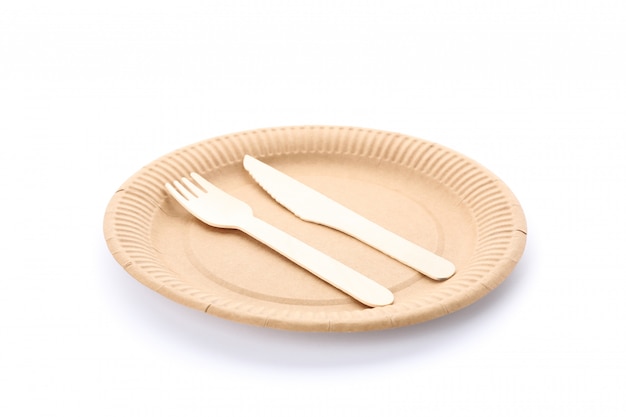 Eco - friendly plate with fork and spoon isolated on white. Disposable tableware