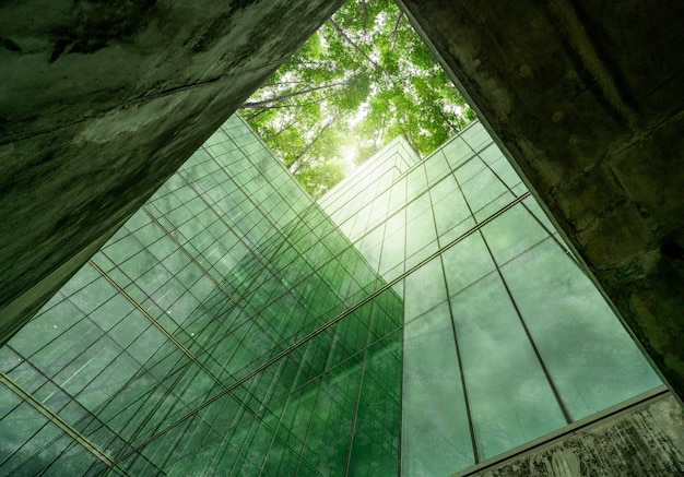 Photo ecofriendly building in modern city sustainable glass office structure with integrated greenery