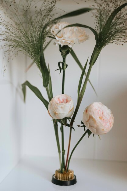 ecofriendly replacement for floral sponge kenzan metal kenzan in a low vase with a bouquet in the style of minimalism