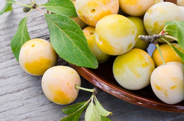 Ecologically grown yellow plums in a bowl