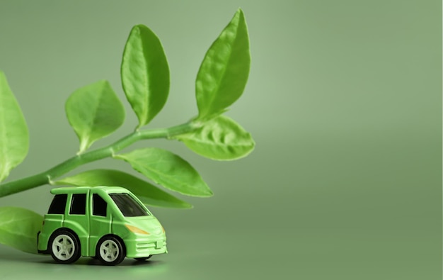 Ecology concept Eco car on a green background The concept of sustainable development Copy space