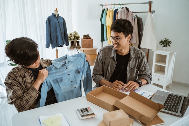 Ecommerce team working together in a clothing store