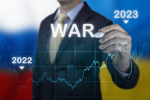 Economic recovery after war Economic crisis that will affect world in 2022 after Russia invasion of Ukraine Businessman pointing graph growth plan on flags restart economy after crisis