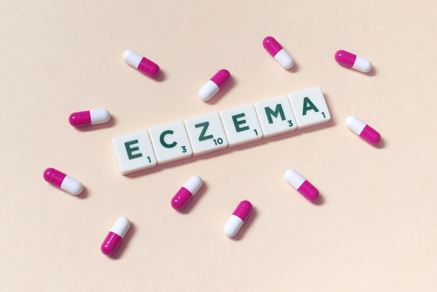 Eczema formed of scrabble tiles and pharmaceutical capsules