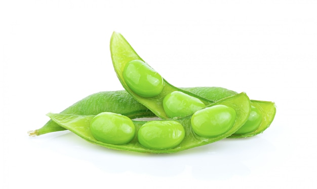 Edamame beans on white wall. 