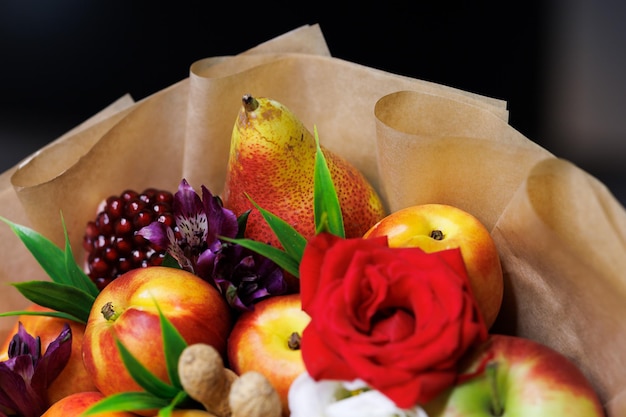 Edible bouquet of food floristry from fruits and roses magic gift