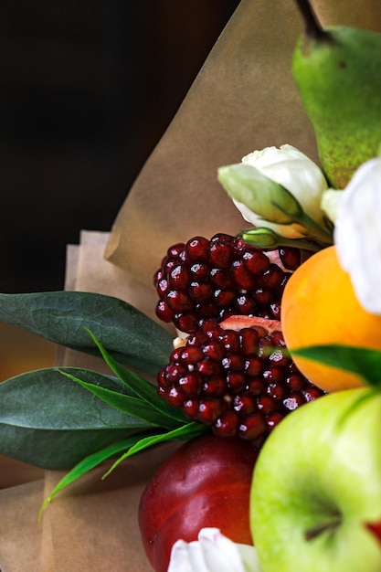 Edible bouquet of food floristry from fruits and roses magic gift