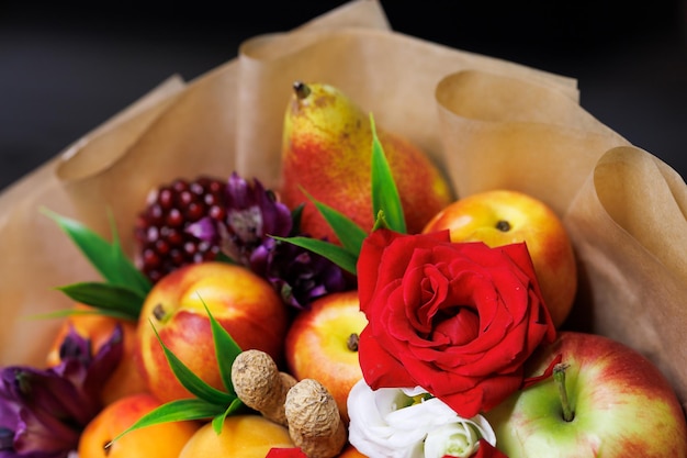 Edible bouquet of food floristry from fruits and roses magic gift