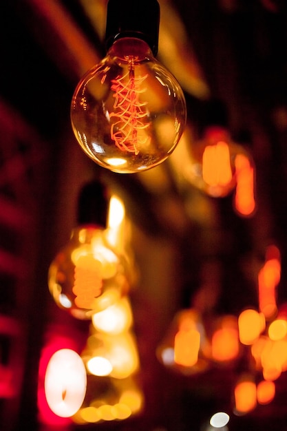 Edison lamp on a black background Incandescent lightbulb with a dark background with bokeh