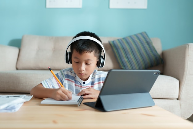 Education. Asian boy learning and doing homework