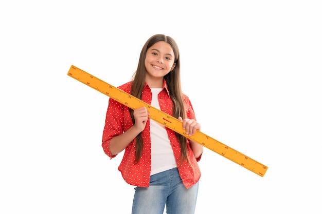 Photo education for child mathematics happy teen girl with ruler back to school