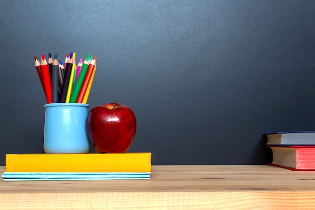 Education concept. Colorful pensils on blackboard background.