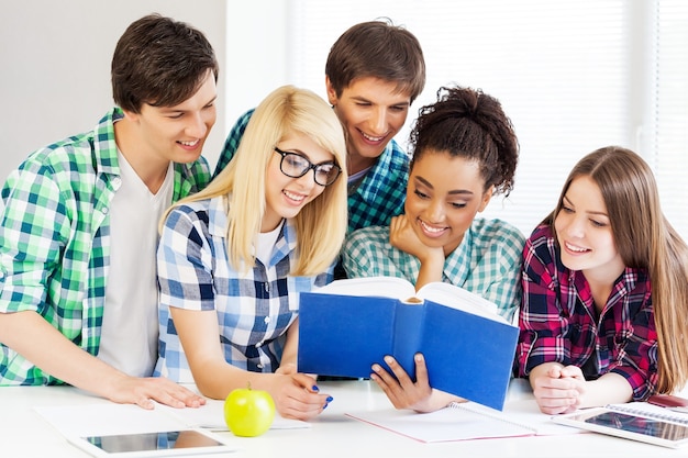 education concept - students reading book at school