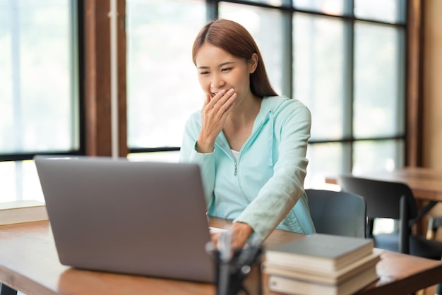 Education concept Teenage girl use laptop to surf social media to relaxation after study tutorial