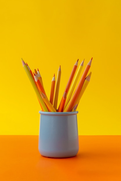 Education concept. Yellow sharpened pencils in holder.